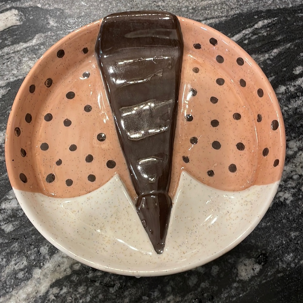 Very unusual vintage dish with lip.